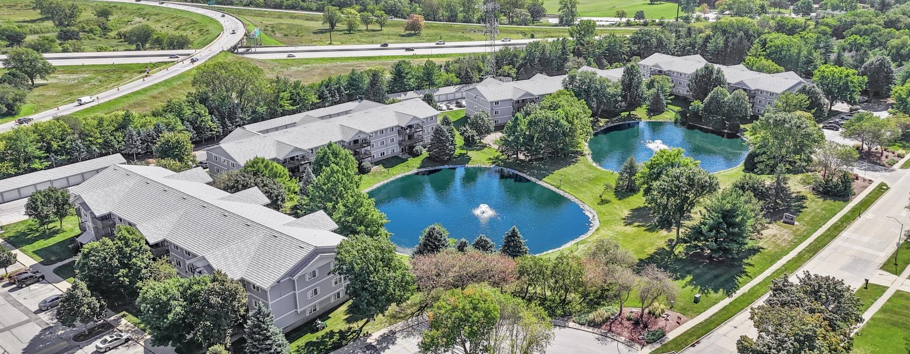 a large building with a pool in the middle of it