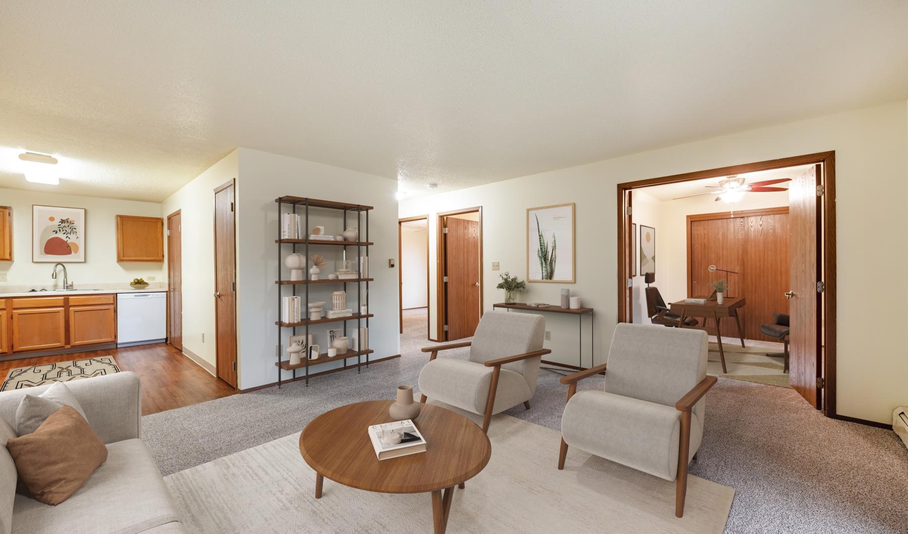 a living room with a table and chairs