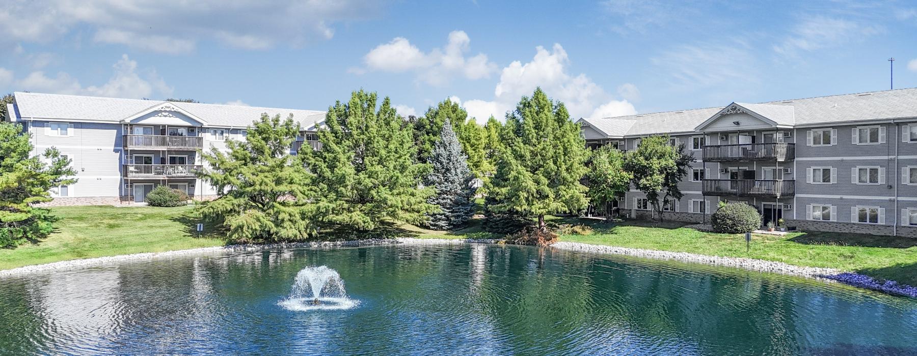 a body of water with a building in the background
