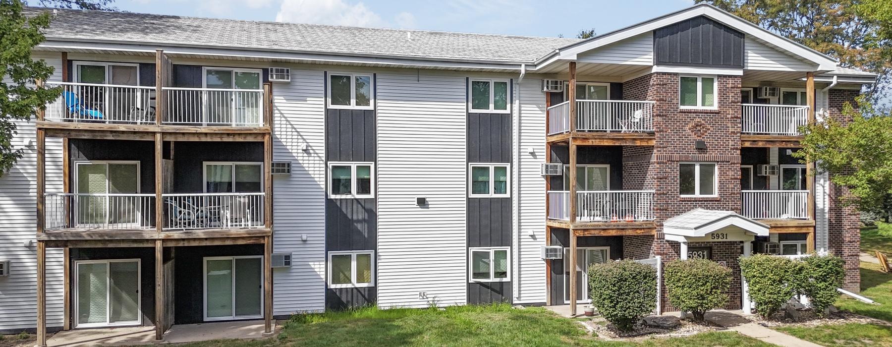 a large house with a lawn in front of it