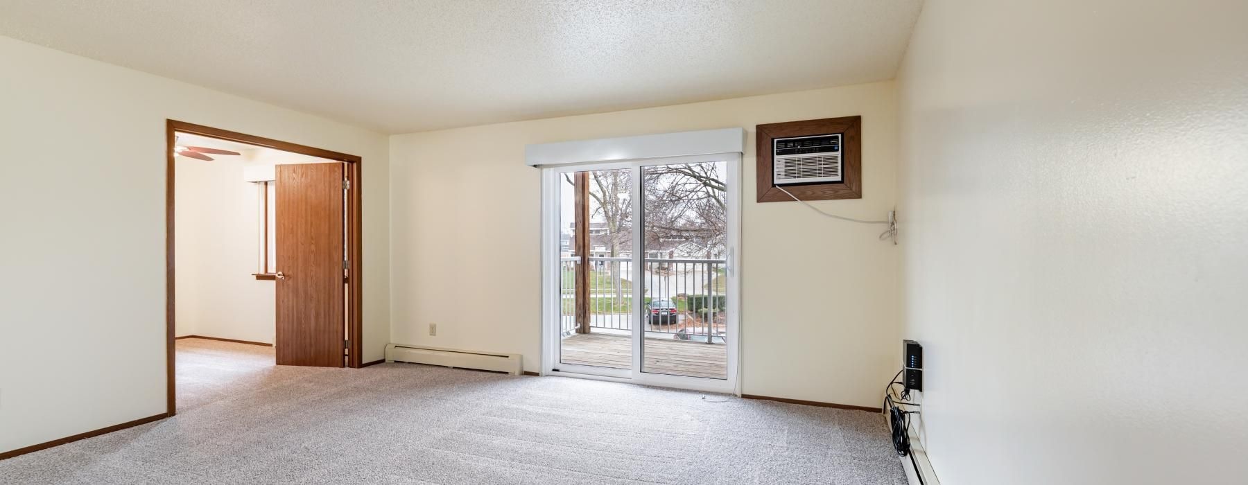 a hallway with a glass door