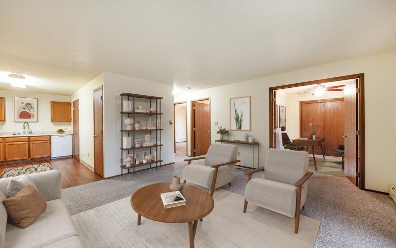 a living room with a table and chairs