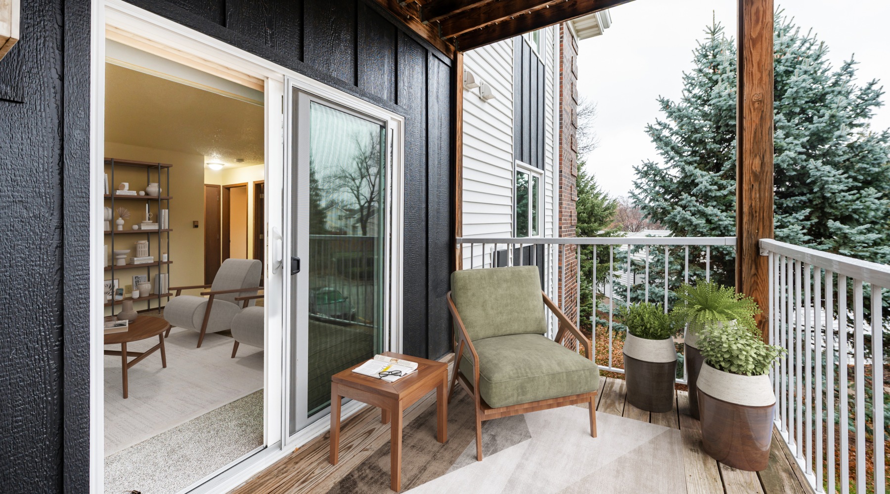 a deck with a wood railing and a wood deck with a white railing