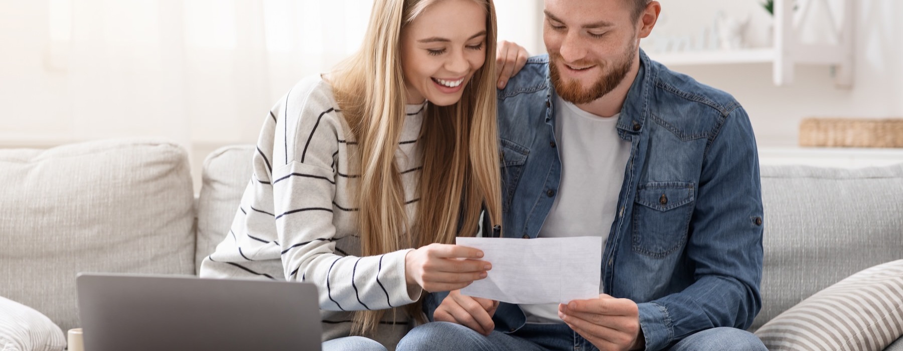 a couple looking at a piece of paper